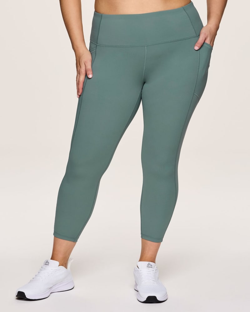 Front of a model wearing a size 1X Prime Tech Flex Ultra Hold Legging in Sea Green by RBX Active. | dia_product_style_image_id:344690